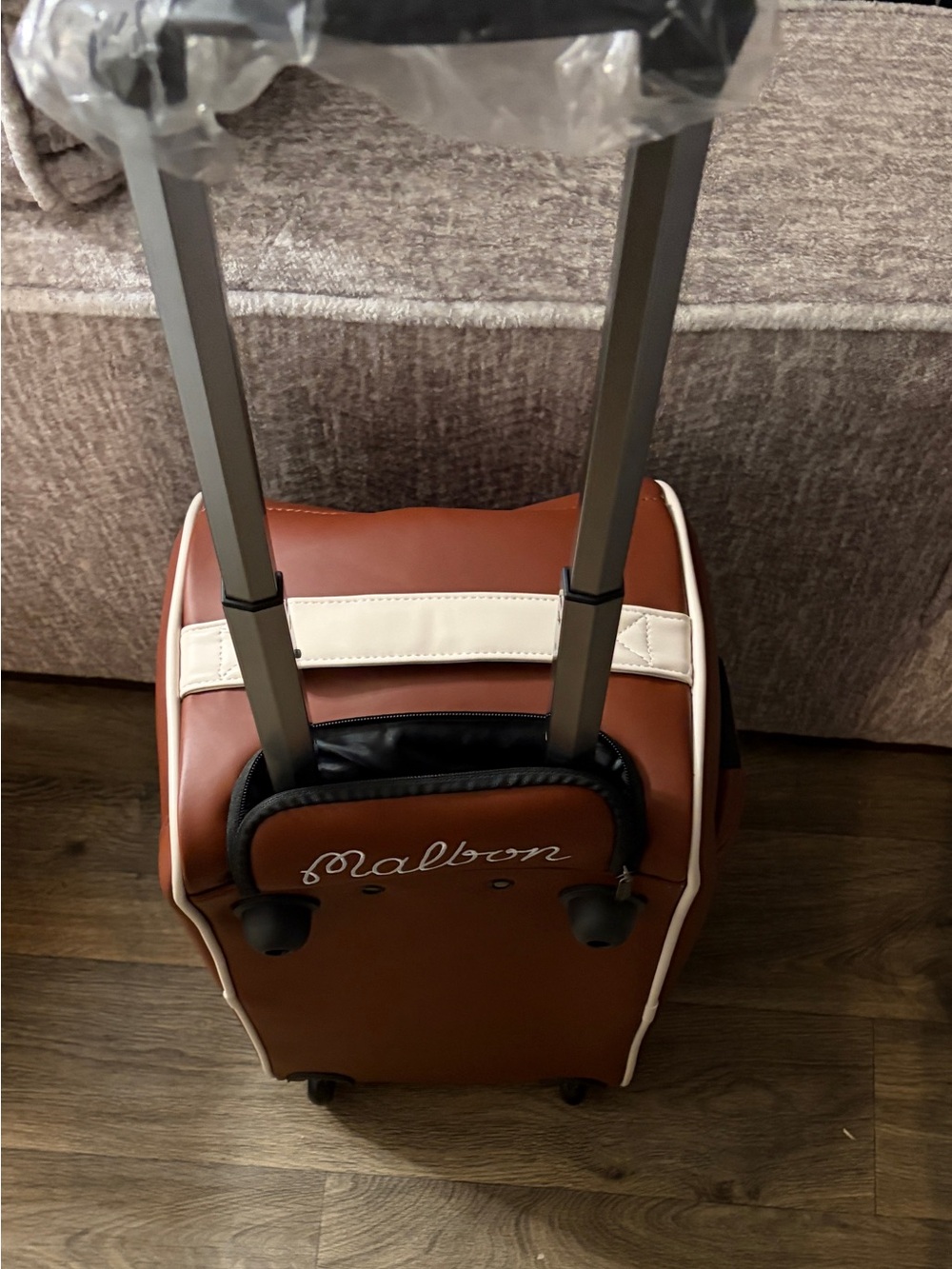 Malbon Boston Luggage Travel bag with retractable handle and wheels.Brown